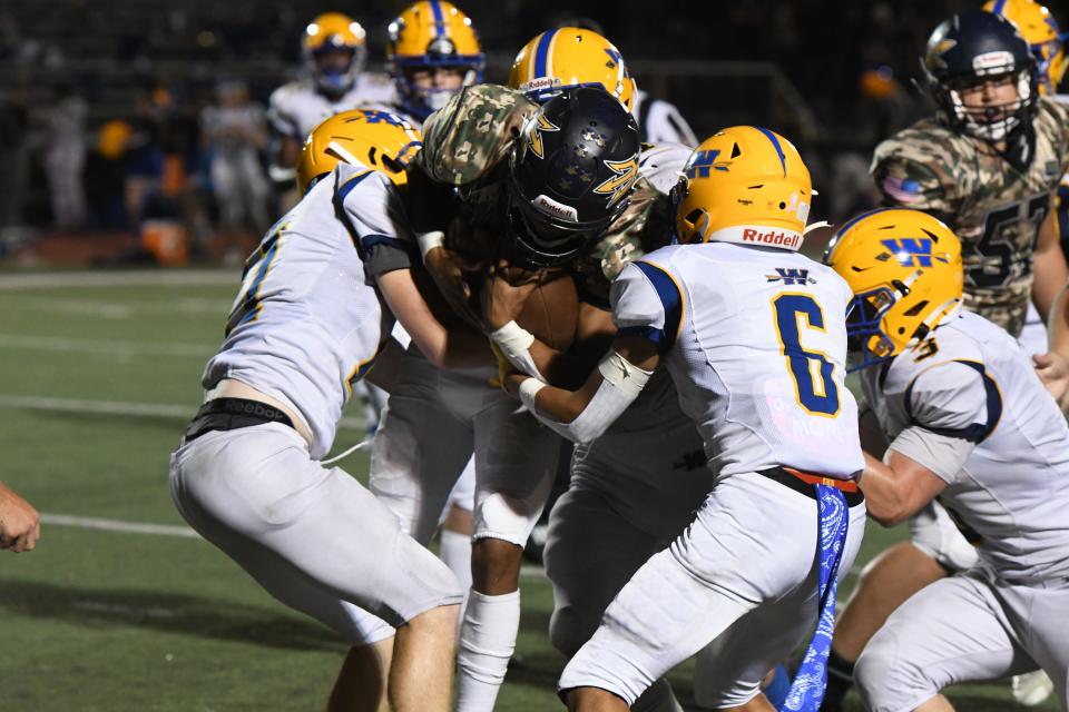 Tavon Cooper is tackled by multiple defenders as Greencastle-Antrim defeated Waynesboro 35-21 on Friday, September 16, 2022