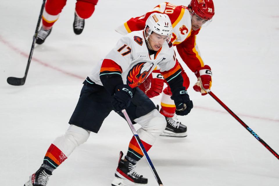 Coachella Valley Firebirds forward Max McCormick (17) competes against the Calgary Wranglers at Acrisure Arena in Palm Desert, Calif., on Wednesday, Jan. 31, 2024.