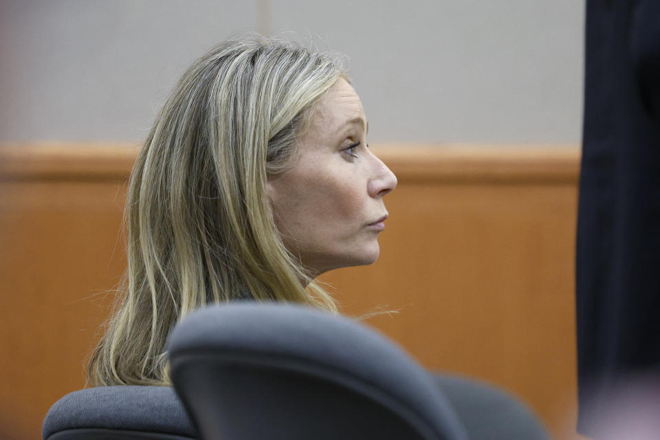 Gwyneth Paltrow sits in court, Thursday, March 23, 2023, in Park City, Utah, where she is accused in a lawsuit of crashing into a skier during a 2016 family ski vacation, leaving him with brain damage and four broken ribs. Terry Sanderson claims that the actor-turned-lifestyle influencer was cruising down the slopes so recklessly that they violently collided, leaving him on the ground as she and her entourage continued their descent down Deer Valley Resort, a skiers-only mountain known for its groomed runs, après-ski champagne yurts and posh clientele.. (AP Photo/Jeff Swinger, Pool)