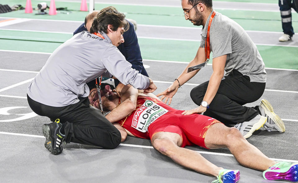 Enrique Llopis, pictured here receiving treatment after falling in the 60m hurdles final at the European Indoor Athletics Championships.