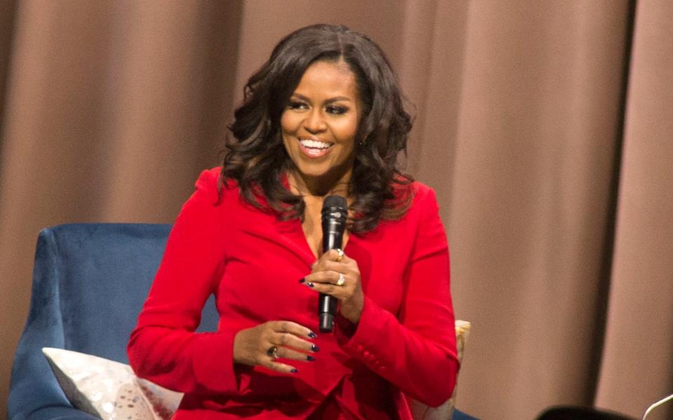 Michelle Obama is the first woman of colour to top the Christmas bestseller list in the UK - Invision