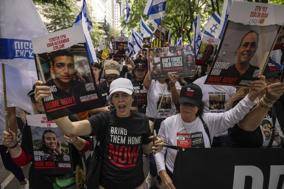 Family members of Israeli hostages march during the annual Israel Day Parade on Fifth Avenue on Sunday, June 2, 2024, in New York. (AP Photo/Yuki Iwamura)