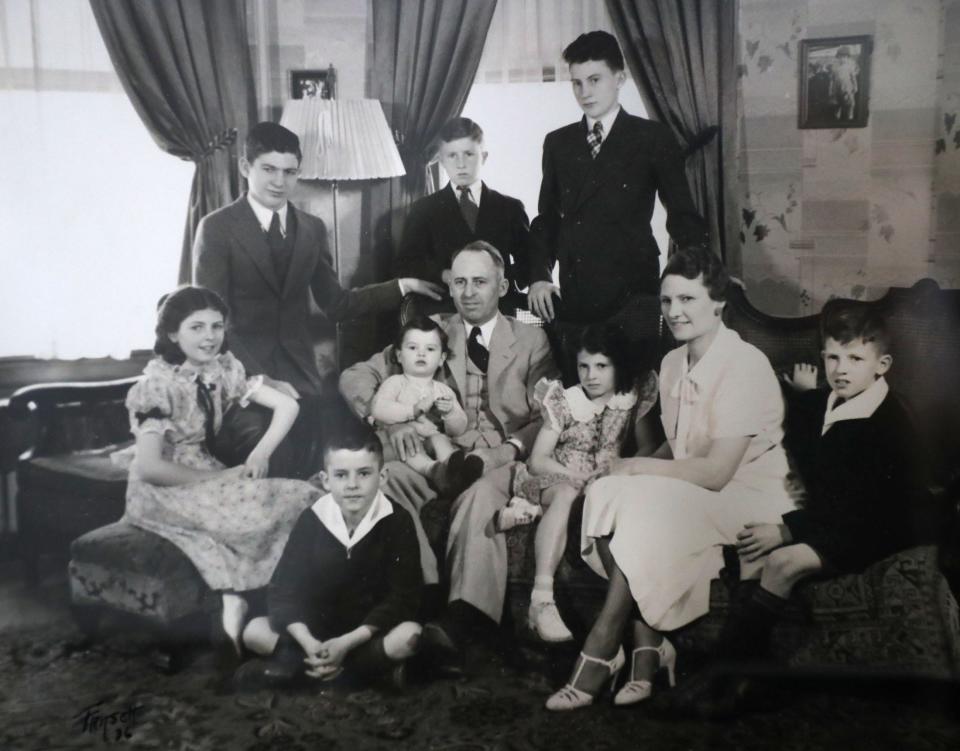 Marge Gallagher grew up in Minnesota in the 1920s and 1930s in a family of seven brothers and sisters. She's pictured on the far left side of this black and white photograph.