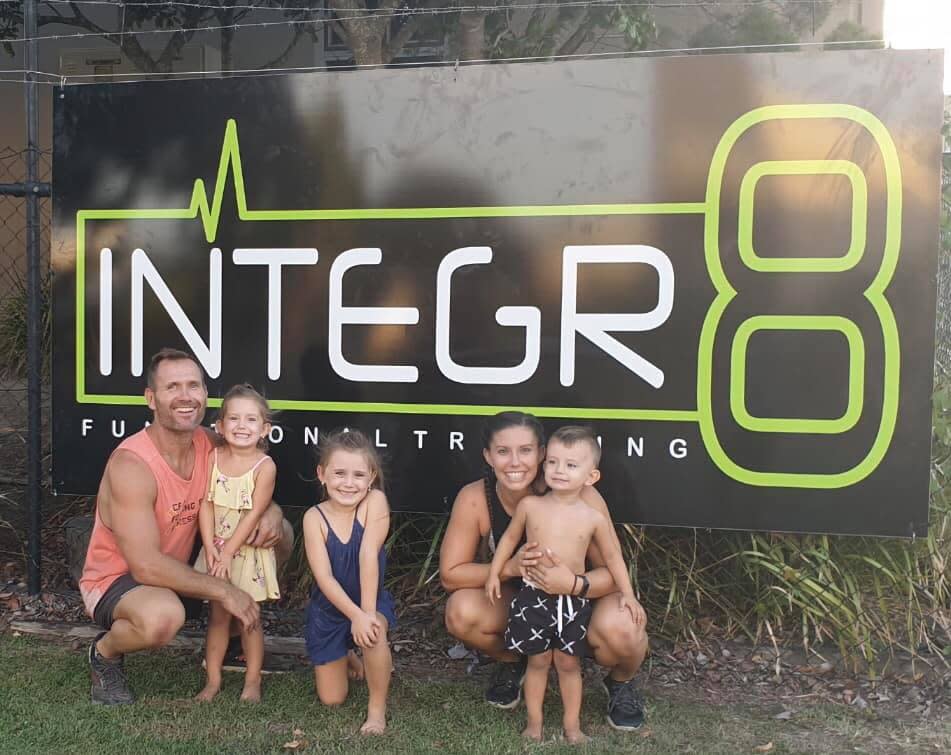 Rowan Baxter with his kids and wife Hannah outside their gym. Source: Facebook