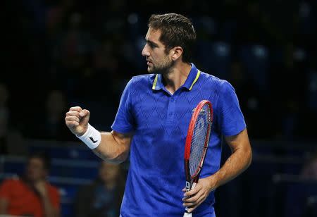 Croatia's Marin Cilic celebrates a point against Kazakhstan's Mikhail Kukushkin during their Kremlin Cup men's semi-final tennis match in Moscow October 18, 2014. REUTERS/Grigory Dukor