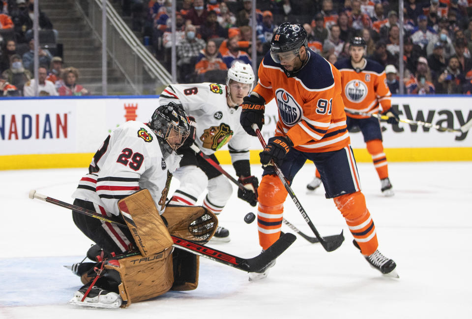 Chicago Blackhawks goalie Marc-Andre Fleury (29) makes a save on Edmonton Oilers' Evander Kane (91) during the second period of an NHL hockey game Wednesday, Feb. 9, 2022, in Edmonton, Alberta. (Jason Franson/The Canadian Press via AP)