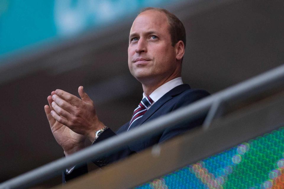 <p>Visionhausl/Getty </p> Prince William, The Duke of Cambridge and President of the Football Association applauds prior to the UEFA Euro 2020 Championship Semi-final match 