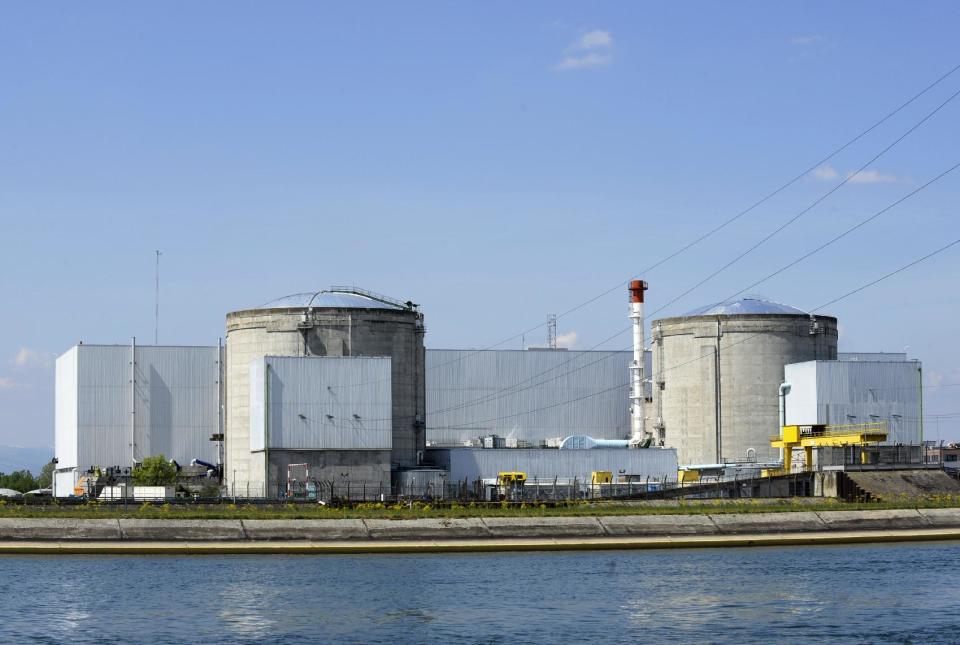 FILE - this April 28 2012 file photo shows the Fessenheim nuclear plant, eastern France. France’s electricity utility company EDF said Wednesday, Sept. 5, 2012 that two people have suffered slight hand burns in a blast of steam at the country’s oldest nuclear reactor. (AP Photo/Winfried Rothermel, dapd, File)