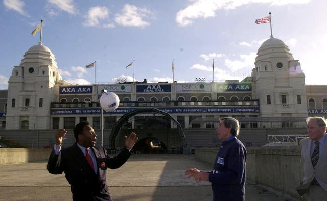Pele and ex-England goalkeeper Gordon Banks, watched by 1966 World Cup final commentator Kenneth Wolstenholme, perform in front of the Wembley twin towers in October 2000. The trio were there in the build up to the final event held at the old stadium before its demolition