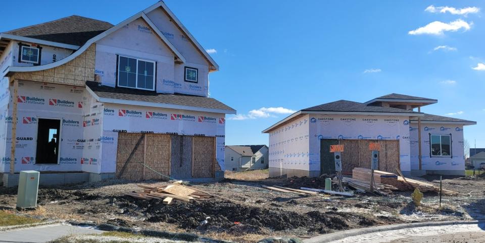 Homes under construction near Waukee High School on Wednesday, Nov. 30, 2022.