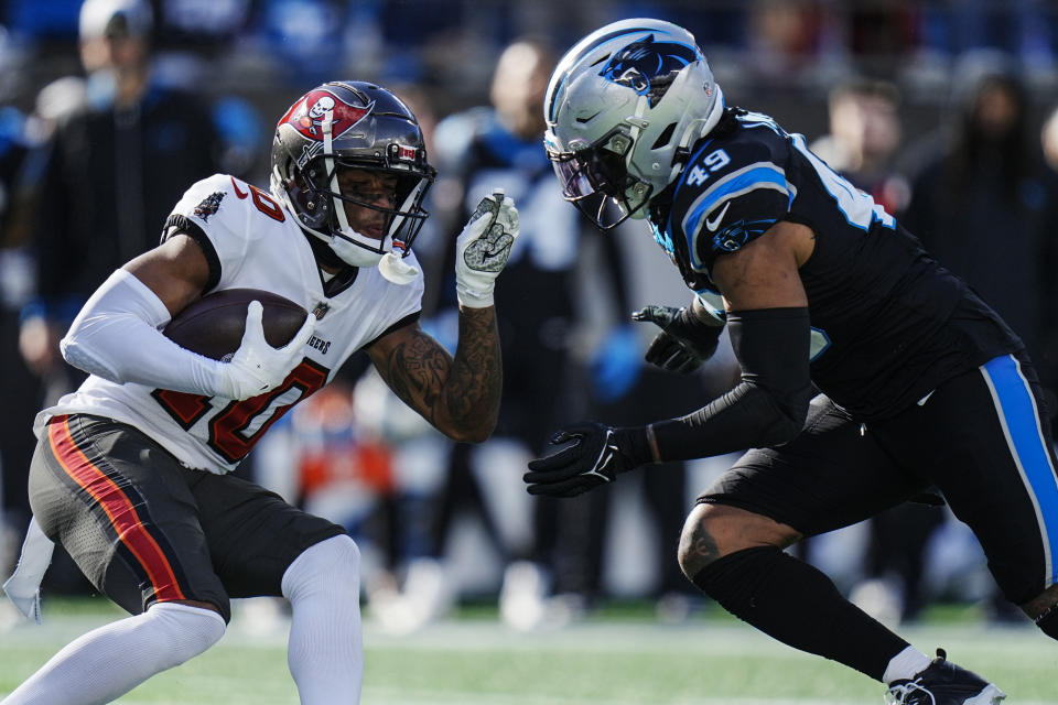 Tampa Bay Buccaneers wide receiver Trey Palmer (10) runs near Carolina Panthers linebacker Frankie Luvu (49) during the first half of an NFL football game, Sunday, Jan. 7, 2024, in Charlotte, N.C. (AP Photo/Rusty Jones)