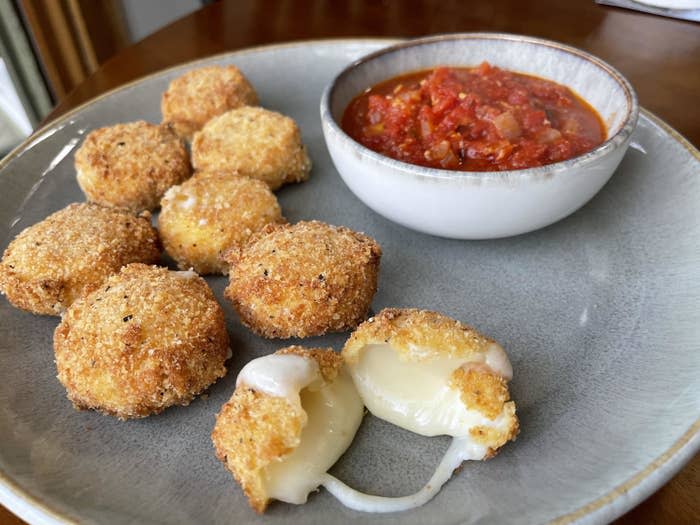 Fried cheese balls with marinara sauce.
