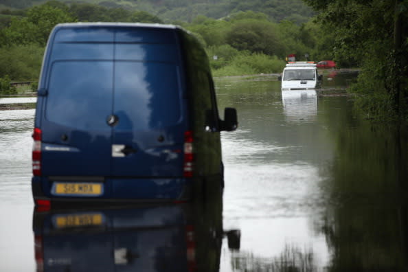 A breakdown truck is stranded in flood waters near the town Machynlleth on June 9, 2012 in Aberystwyth, Wales. Severe flooding has affected mid Wales with a major rescue operation under way taking to safety nearly 100 people so far. (Photo by Christopher Furlong/Getty Images)