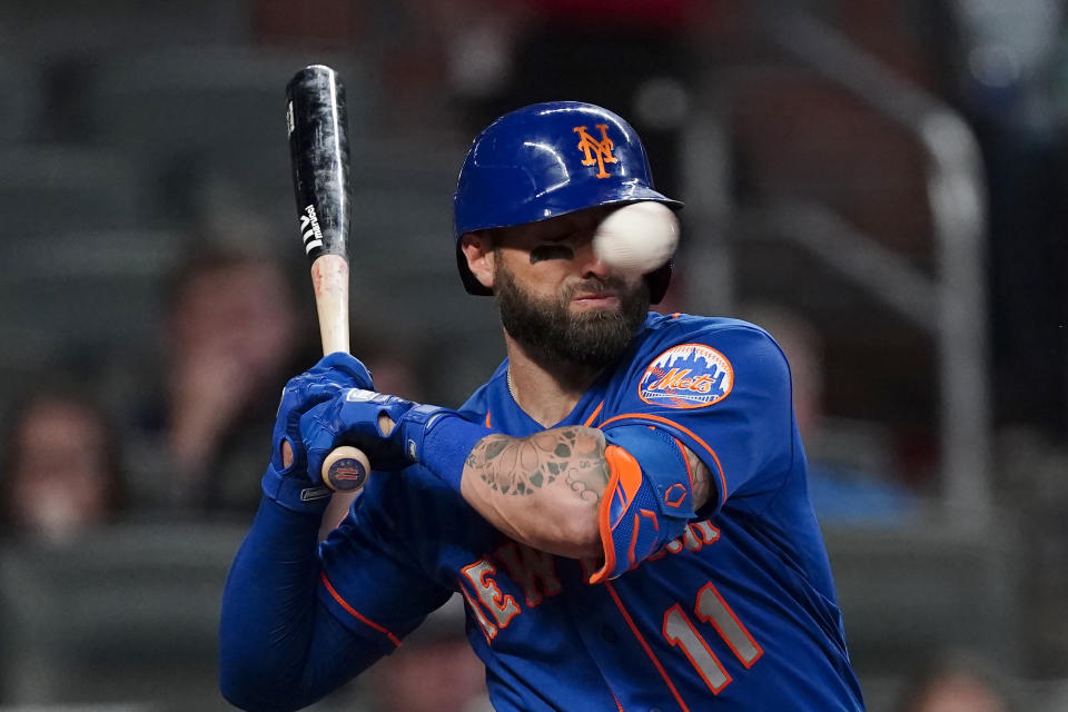 New York Mets' Kevin Pillar is hit in the face with a pitch from Atlanta Braves pitcher Jacob Webb in the seventh inning of a baseball game Monday, May 17, 2021, in Atlanta. (AP Photo/John Bazemore)