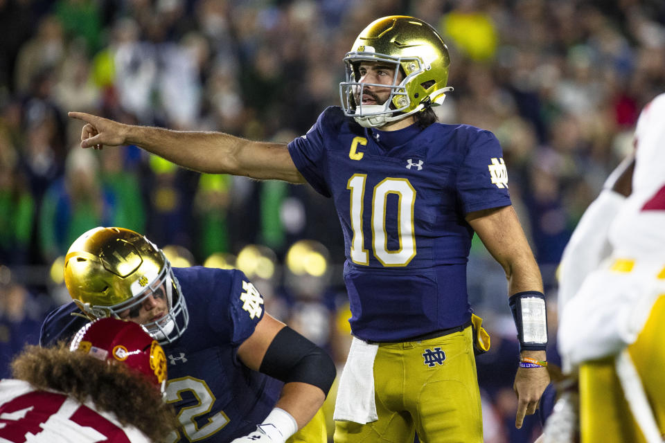 Notre Dame quarterback Sam Hartman (10) signals at the line of scrimmage during the first half an NCAA college football game against Southern California Saturday, Oct. 14, 2023, in South Bend, Ind. (AP Photo/Michael Caterina)