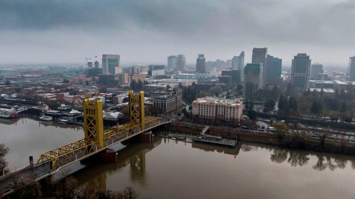 A view of the Sacramento skyline from above shows the Tower Bridge and water levels on the Sacramento River after overnight showers fell in the Sacramento region on Wednesday, Dec. 22, 2021.