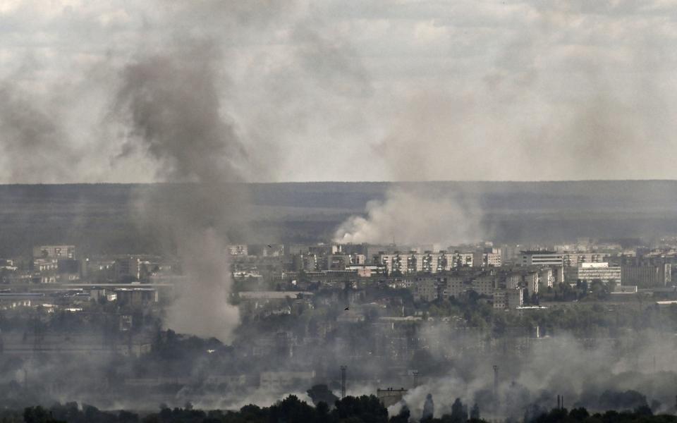 Smoke and dirt rise from shelling in the city of Severodonetsk, in the eastern Ukrainian region of Donbas, on June 7, 2022.  - Aris Messinis/AFP