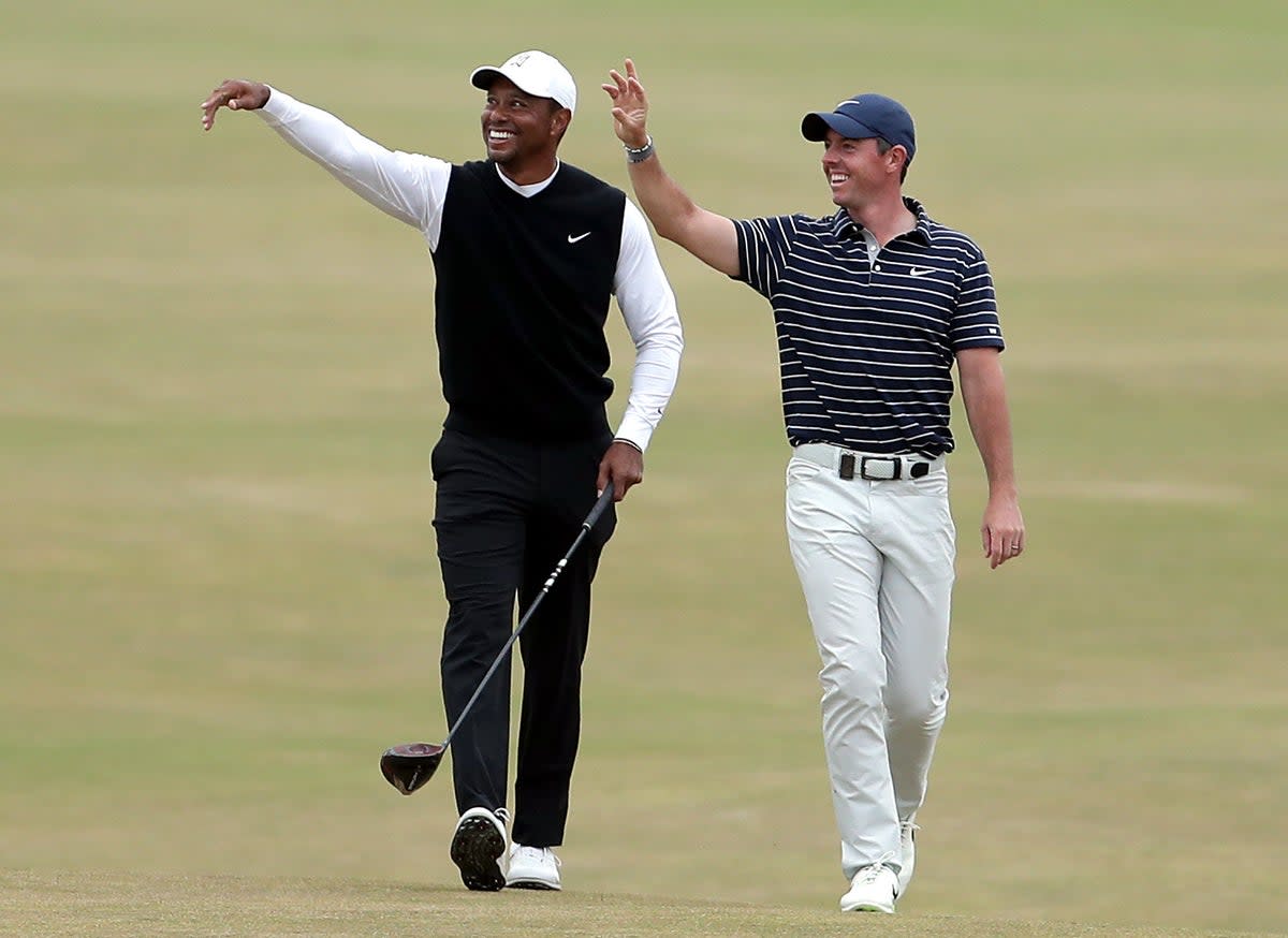 Tiger Woods (left) remains Rory McIlroy’s hero  (PA Wire)