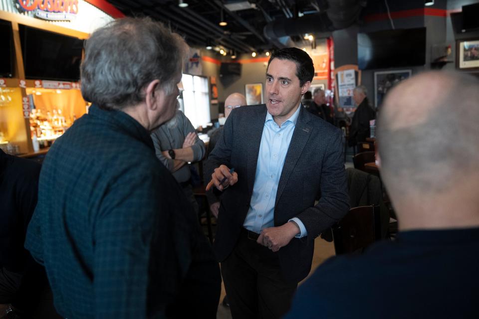 Feb 2, 2024; Marysville, Ohio, US; U.S. Senator Candidate and current Ohio Secretary of State Frank LaRose speaks to Randy Poland (left) during a campaign event at Boston's Restaurant and Sports Bar in Marysville, Ohio.