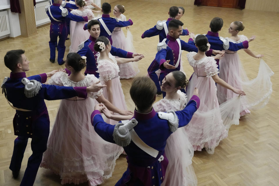 Dancers of the WARSZAWIANKA ensemble of the University of Warsaw dance Poland's national polonaise dance in 18th century costumes during dress rehearsal in Warsaw, Poland, on Feb. 8, 2024. Once banned by rulers dispatched from Moscow, Poland's stately polonaise dance that nurtured the country's spirit even through the dark years of its partition is now honored by the United Nations' education and culture agency, UNESCO. (AP Photo/Czarek Sokolowski)