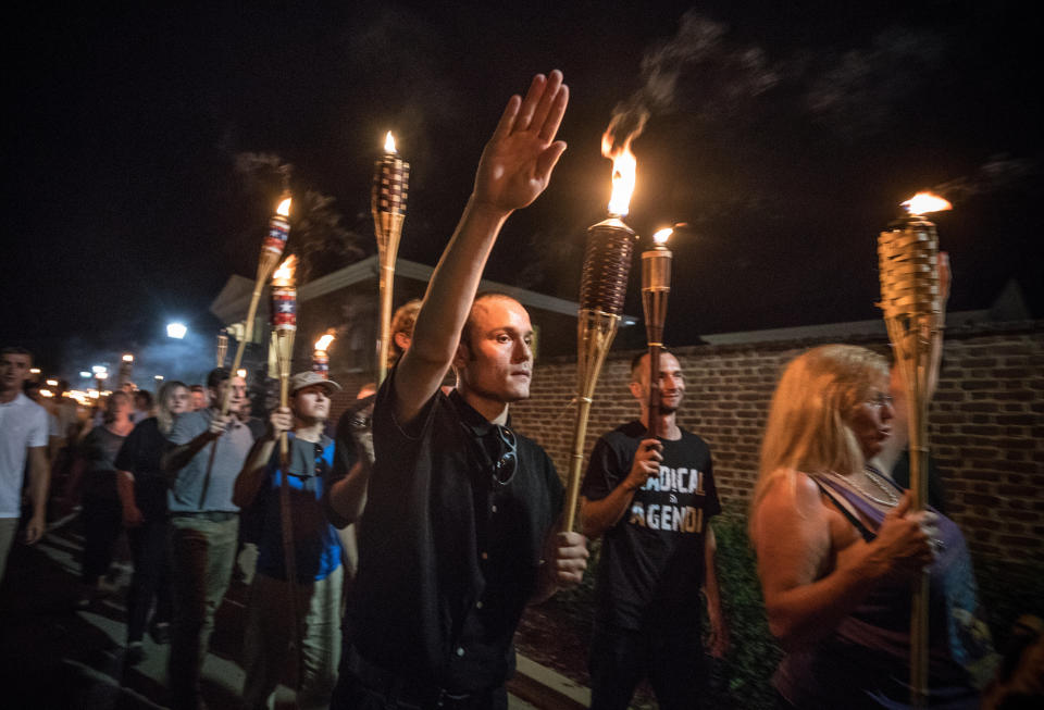 Chanting, "White lives matter! You will not replace us!" and "Jews will not replace us!" white nationalists and white supremacists march through the University of Virginia campus on Aug. 11, 2017. (Photo: Evelyn Hockstein for the Washington Post via Getty Images)