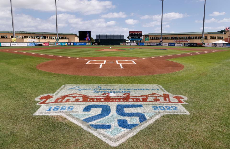 Mar 22, 2022; Jupiter, Florida, USA; A 25th anniversary logo is painted on the field for the Florida Marlins against the St. Louis Cardinals game during spring training at Roger Dean Stadium. Mandatory Credit: Rhona Wise-USA TODAY Sports