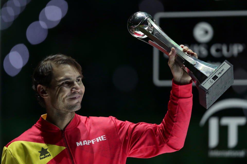 Spain's Rafael Nadal holds the tournament's best player award after Spain defeated Canada in the Davis Cup final in Madrid, Spain, Sunday, Nov. 24, 2019. (AP Photo/Manu Fernandez)