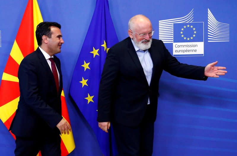 FILE PHOTO: Macedonian PM Zaev poses with EU Commission Vice President Timmermans in Brussels