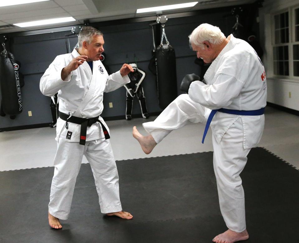 Karate International, based in Exeter, recently expanded its campus to Barrington. Its first adult student was 82-year-old Don Staton. Instructor John English works with him on offense and defense.