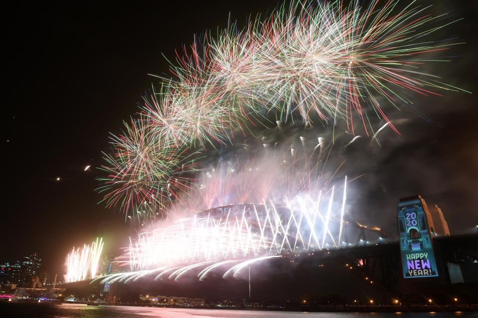 Fireworks explode above the Sydney Harbour Bridge, as seen from Kirribilli during New Year's Eve celebrations in Sydney.