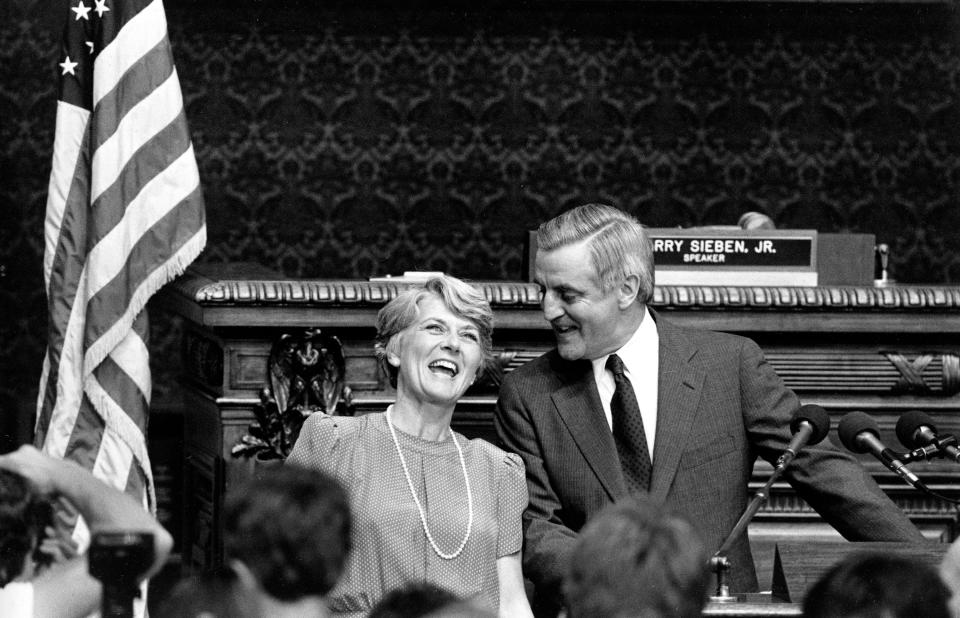 FILE - Vice presidential candidate Walter Mondale, right, and congresswoman Geraldine Ferraro stand before a packed house at the State Capitol of the Minneapolis House of Representatives in St. Paul, Minn., Thursday afternoon, July 12, 1984. Mondale announced Ferraro, from New York, as his vice presidential running mate. (AP Photo/Larry Salzman, File)