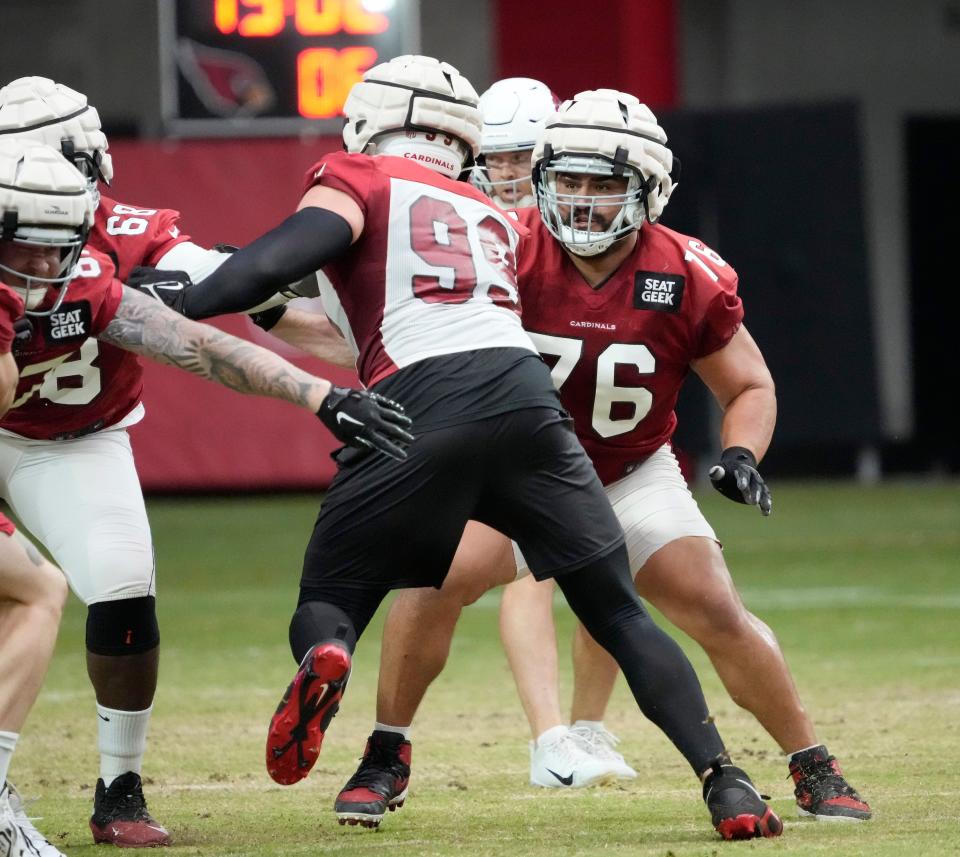 Arizona Cardinals offensive guard Will Hernandez (76) blocks defensive end J.J. Watt (99) during training camp at State Farm Stadium.