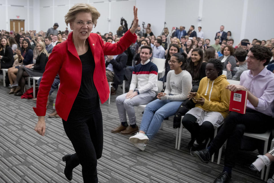 Sen. Elizabeth Warren, D-Mass., waves as she departs after speaking at the American University Washington College of Law in Washington, Thursday, Nov. 29, 2018, on her foreign policy vision for the country. (AP Photo/Andrew Harnik)