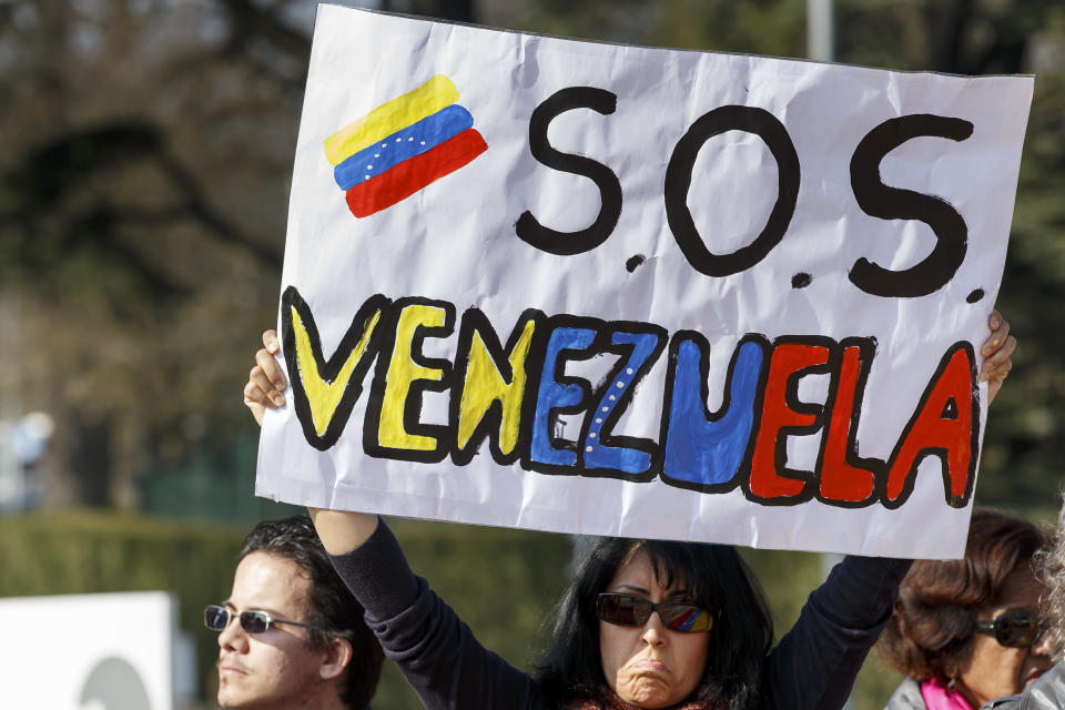 A woman protests during a rally against the Venezuela's government on the Place des Nations in front of the European headquarters of the United Nations, in Geneva, Switzerland, Saturday, March 8, 2014. (AP Photo/Keystone,Salvatore Di Nolfi)