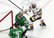 Dallas Stars goalie Anton Khudobin (35), Stars' John Klingberg (3) and Vegas Golden Knights' Alex Tuch (89) look for a rebound during second-period NHL Western Conference final playoff game action in Edmonton, Alberta, Saturday, Sept. 12, 2020. (Jason Franson/The Canadian Press via AP)