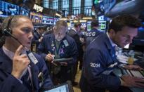 Traders work on the floor of the New York Stock Exchange March 19, 2014. REUTERS/Brendan McDermid