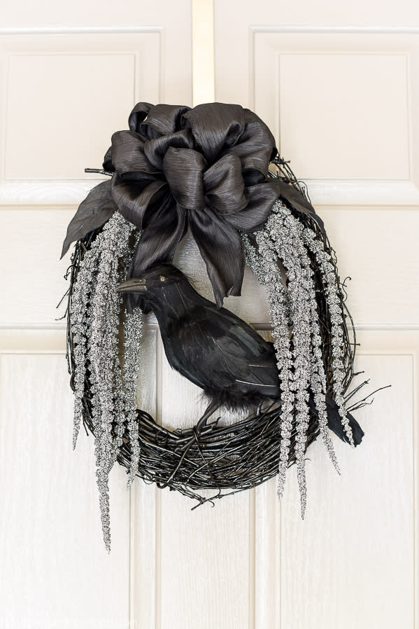 black grapevine wreath with fake crow (A Pumpkin & A Princess)