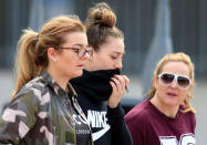 <p>People walk out of a support center at Manchester City’s Etihad Stadium, Manchester, Britain, May 23, 2017. (Jon Super/Reuters)) </p>