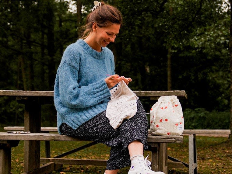 A picture of Lindberg knitting her wedding dress.