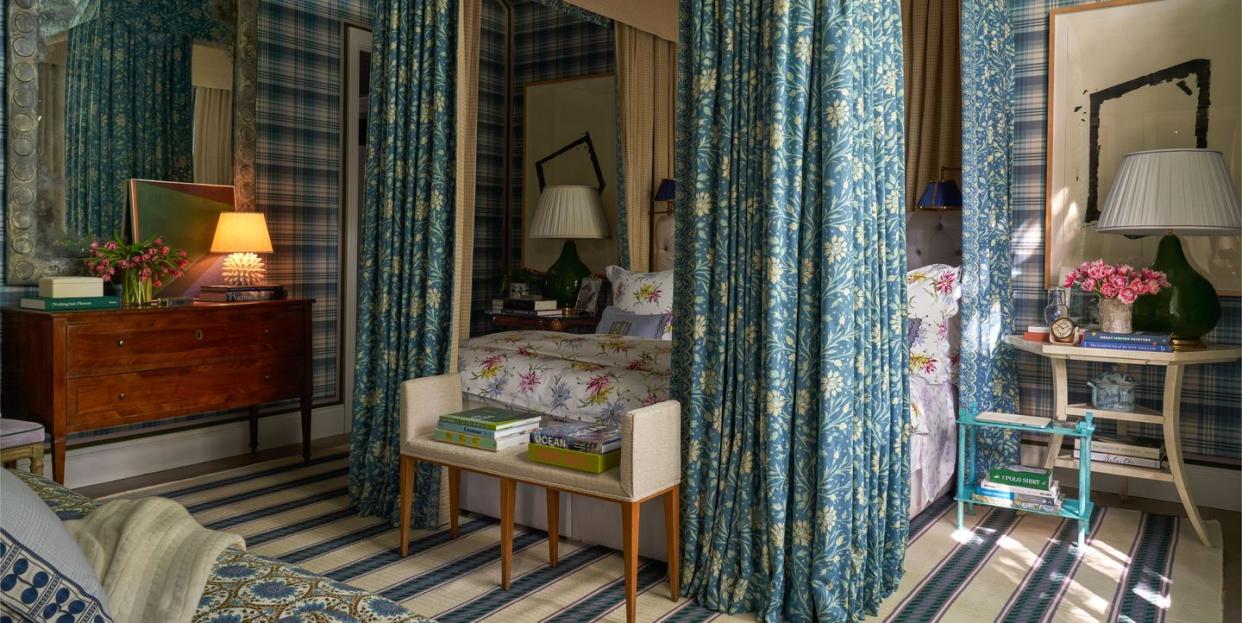 blue patterned bedroom with side table