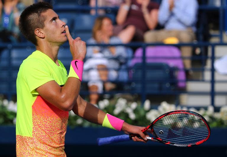 Borna Coric of Croatia reacts after defeating Andy Murray at the Dubai Duty Free Tennis Championships on February 26, 2015