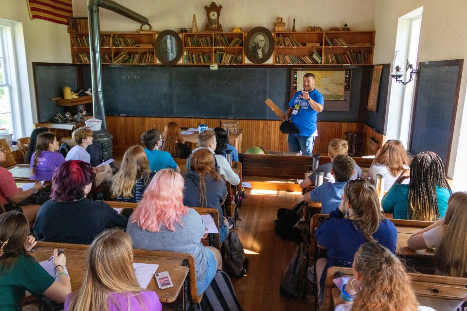 Kansas Future Teacher Academy director Todd Roberts jokes about how discipline has changed since paddles were used in one-room schoolhouses.