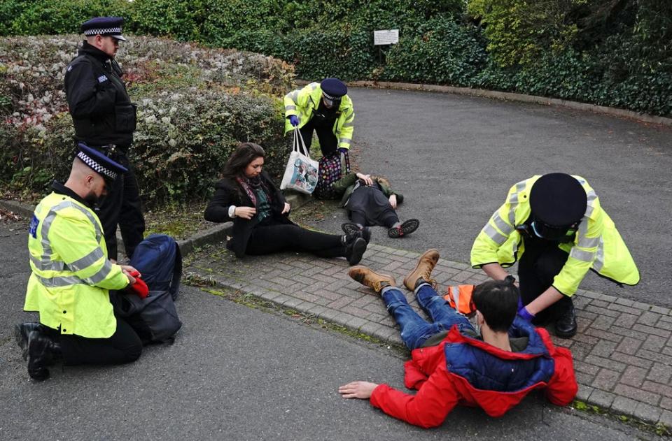 Protesters from Insulate Britain are arrested by police in the car park of the DoubleTree Hilton at Dartford Crossing (Jonathan Brady/PA) (PA Wire)