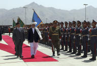 President Ashraf Ghani, center, inspects the honor guard during the extraordinary meeting of the Parliament in Kabul, Afghanistan, Monday, Aug. 2, 2021. (AP Photo/Rahmat Gul)