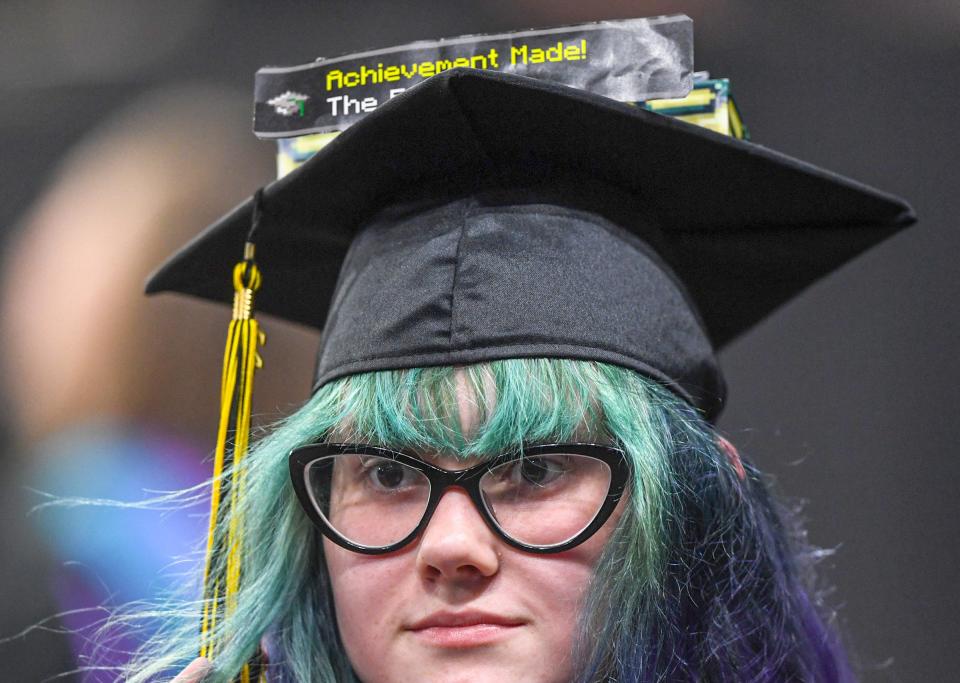 Chyanne Haylee Wilhelm gets her diploma with building blocks attached to her cap "Achievement Made" written on them, during the 2024 ceremony for Pendleton High School in Littlejohn Coliseum in Clemson, S.C. Tuesday, May 21, 2024.