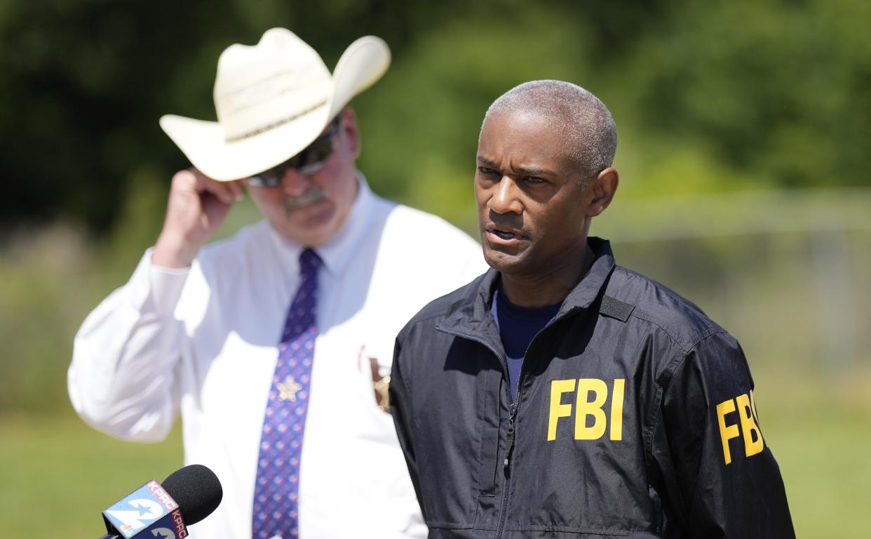 FBI Houston Special Agent in Charge James Smith speaks during a news conference, Sunday, April 30, 2023, in Cleveland, Texas. The search for a Texas man who allegedly shot his neighbors after they asked him to stop firing off rounds in his yard stretched into a second day Sunday, with authorities saying the man could be anywhere by now. The suspect fled after the shooting Friday night that left five people dead, including a young boy. (AP Photo/David J. Phillip)