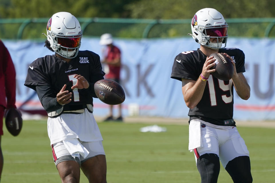 Arizona Cardinals quarterbacks Kyler Murray (1) and Trace McSorley (19) take part in drills during NFL football training camp Wednesday, Aug. 24, 2022, in Nashville, Tenn. The Cardinals and Tennessee Titans are holding a training camp practice together. (AP Photo/Mark Humphrey)