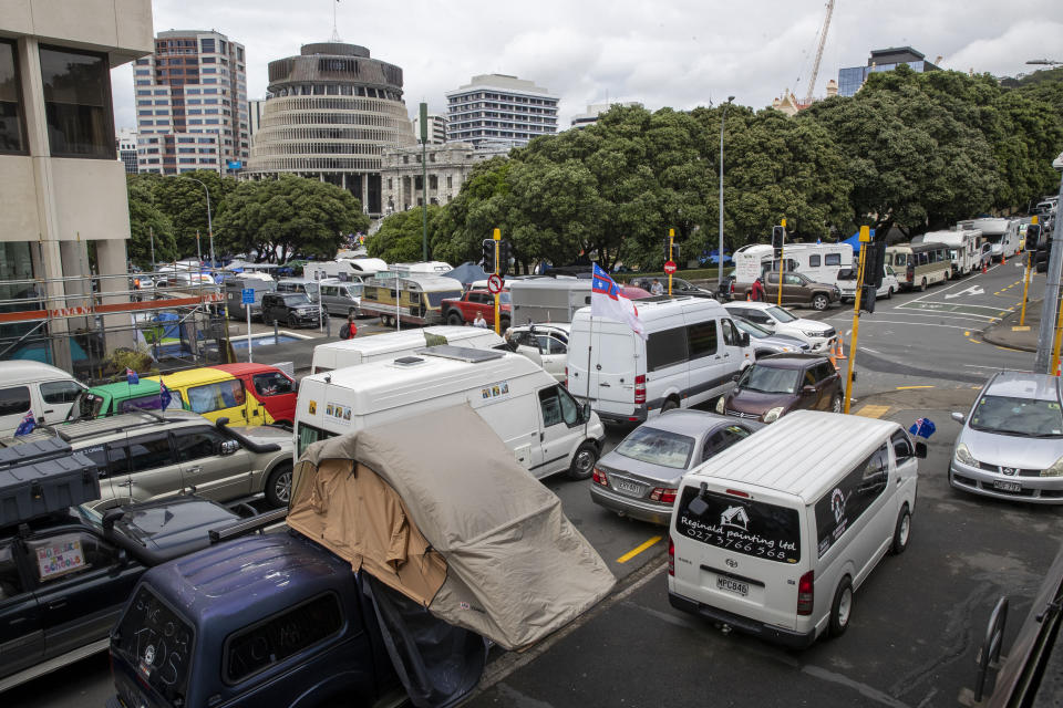 Vehicles of protesters against vaccine mandates, are parked on the streets near Parliament in Wellington, New Zealand Monday, Feb. 14, 2022. The protesters are not planning to leave any time soon after they drove in convoys from around the country nearly a week ago, setting up tents on Parliament's grounds and blocking surrounding streets with their cars and trucks. (Mark Mitchell/New Zealand Herald via AP)