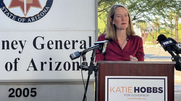 PHOTO: Arizona attorney general candidate Kris Mayes reacts to a judge ruling that a near-total abortion ban must be enforced in Arizona, at a press conference outside the Attorney General's office in Phoenix, on Sept. 24, 2022. (Libby Cathey/ABC News)