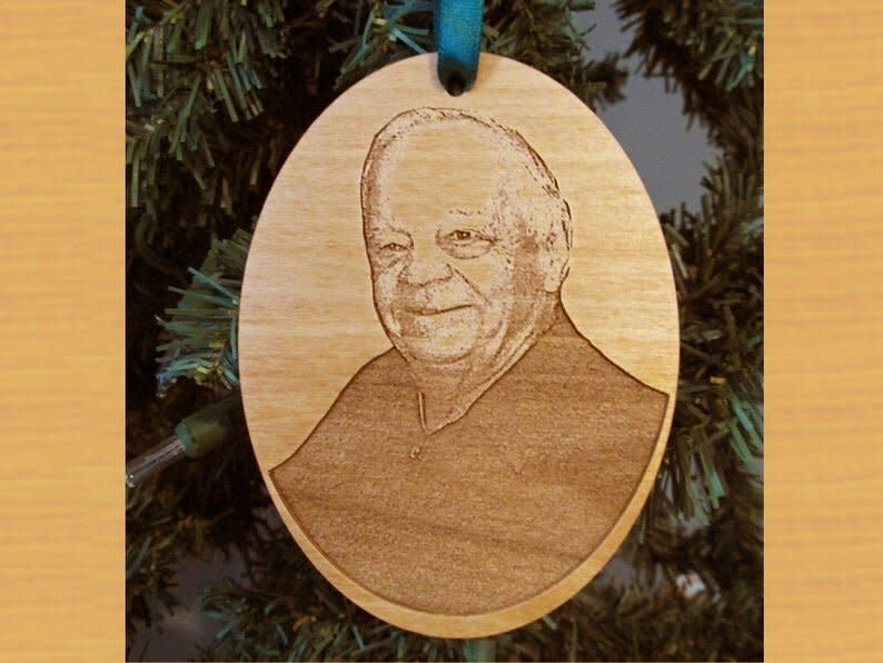 Sympathy or memorial ornaments are a way to spread some extra love during the holiday. Personalize it for an extra special touch that will light up their tree, <a href="https://fave.co/2P7rtjY" target="_blank" rel="noopener noreferrer">like this wooden photo ornament</a> or this <a href="https://www.etsy.com/listing/748574019/memorial-ornament-memorial-christmas" target="_blank" rel="noopener noreferrer">personalized memorial ornament</a>. <a href="https://fave.co/2P7rtjY" target="_blank" rel="noopener noreferrer">Get them on Etsy</a>.